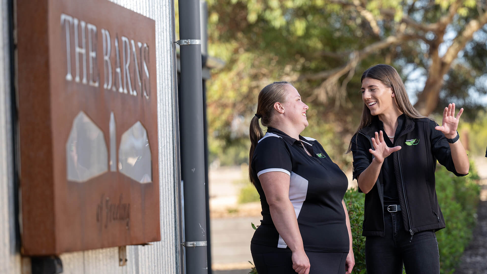 A female employer talking to her employee in an inclusive employment workplace